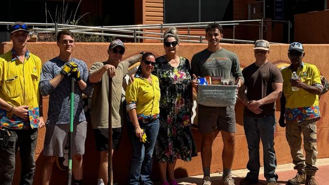 Katherine Town Council were given a helping hand by United States Air Force (USAF) members who were due to post-out, with the American group rolling up their sleeves to touch up the local Visitor Information Centre. Picture: Supplied.