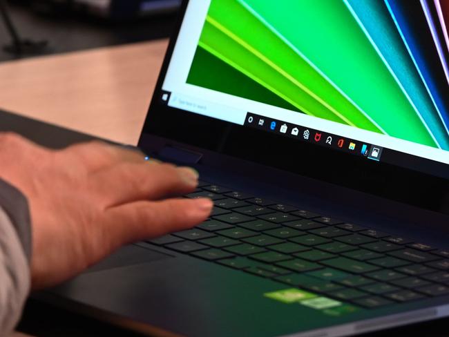 An attendee looks at a Samsung Galaxy Book laptop computer January 10, 2020 on the final day of the 2020 Consumer Electronics Show (CES) in Las Vegas, Nevada. (Photo by Robyn Beck / AFP)