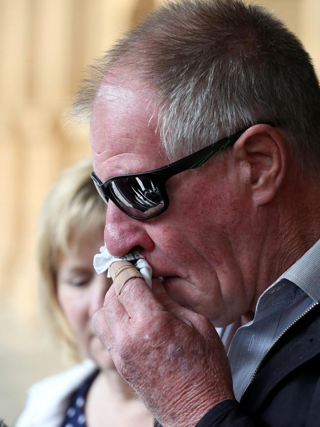 Malcolm Boyce, the father of the victim, reacts as he speaks to reporters outside the Adelaide Supreme Court in Adelaide. Picture: AAP / Kelly Barnes