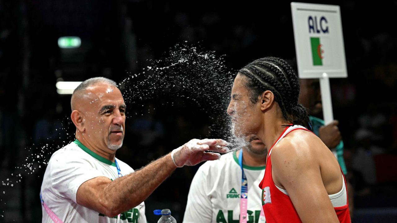 Algeria's Imane Khelif (in red) has plans on winning gold. (Photo by MOHD RASFAN / AFP)