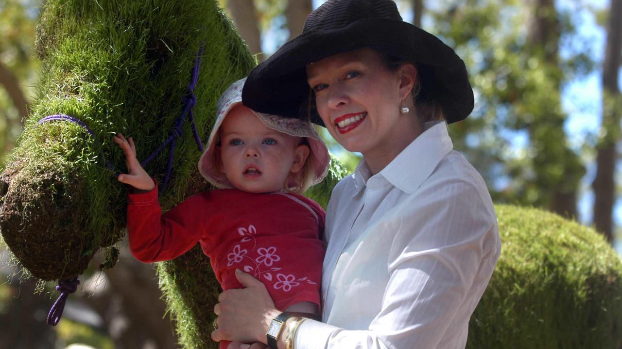 Elissa Finlay with daughter Sophia 2yr pating a Grass Stallion at the Food &amp; Wine Pavilion in Queens Park, Toowoomba. Picture: David Martinelli.