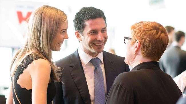 Ryan Stokes with fiance Claire Campbell and Defence Minister Marise Payne in the Olympic room of the MCG during the AFL Grand Final. Pic: AFL Media