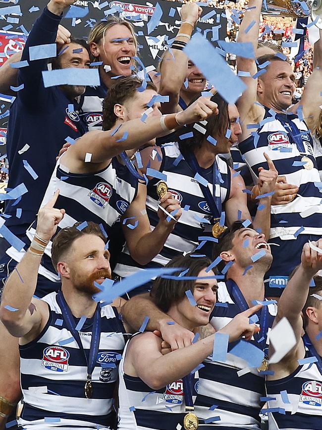 The Cats celebrating their win.