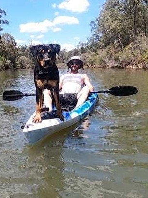 Alister MacPhee and his dog before being the pair were attacked by a big croc on the Bloomfield River on Wednesday, February 22. Picture: Facebook