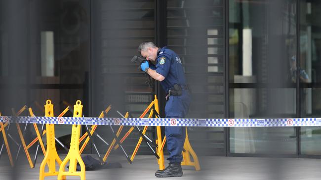 Police inside the school grounds today. Picture: Richard Dobson