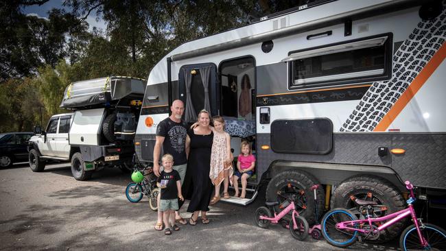 The Thompson family, parents Mick and Tye with children Lucy, 6, Ollie, 4, and Poppie, 2, are about to travel Australia because the cost of living and electricity prices are too high. Picture Emma Brasier