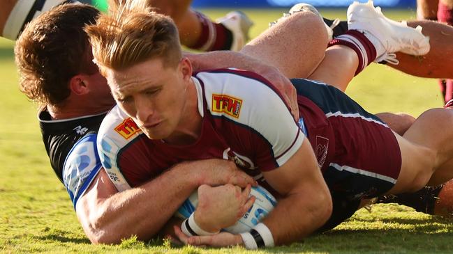 PERTH, AUSTRALIA - MARCH 23: Tate McDermott of the Reds scores a try  during the round five Super Rugby Pacific match between Western Force and Queensland Reds at HBF Park, on March 23, 2024, in Perth, Australia. (Photo by James Worsfold/Getty Images)