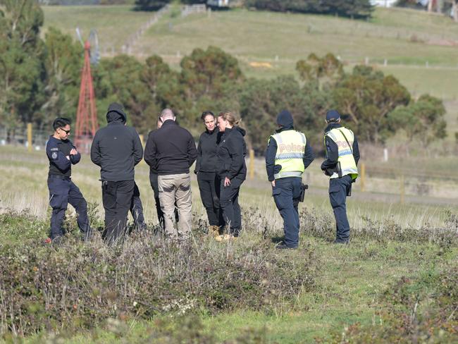 Detectives from Victoria’s Missing Persons Squad take part in the search. Picture: Ian Wilson