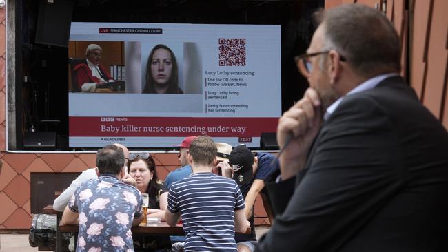 A large television screen near Manchester Crown Court broadcasts the judge sentencing convicted hospital nurse Lucy Letby. Picture: Getty Images.