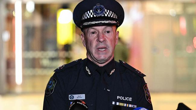 Assistant Police Commissioner Scott Duval speaks to journalists outside the Westfield Marion, after the mall went into lockdown. Picture: Michael Errey / AFP