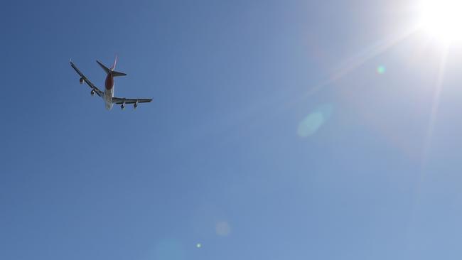 A Qantas Jumbo over Gold Coast Airport. Picture: Glenn Hampson.