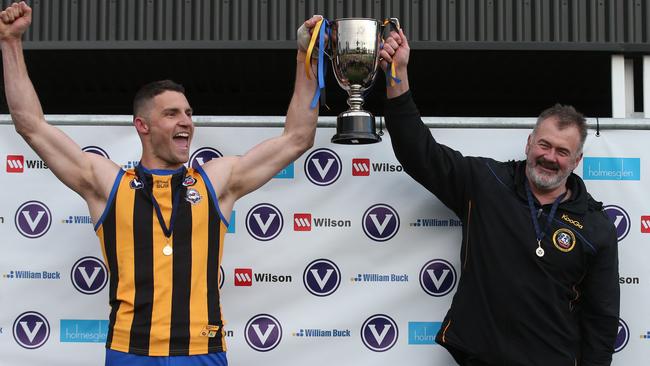 St Bernards captain Simon Caven and coach Mark Roley hoist the silverware. Picture: David Crosling