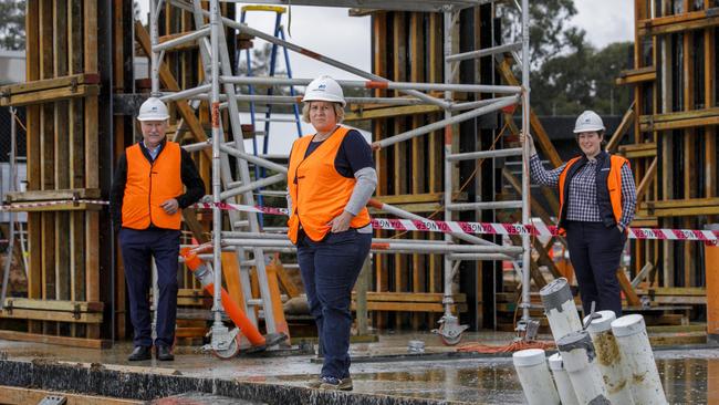 MBA chief executive Denita Wawn, centre, on a Manteena construction site in Canberra with its CEO Simon Butt and project manager Jemma Butt. Picture: Sean Davey