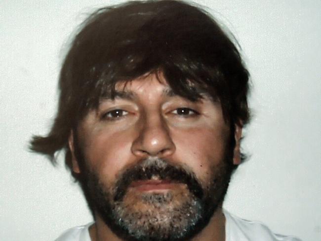 A bewigged Tony Mokbel in the infamous 2007 mugshot.