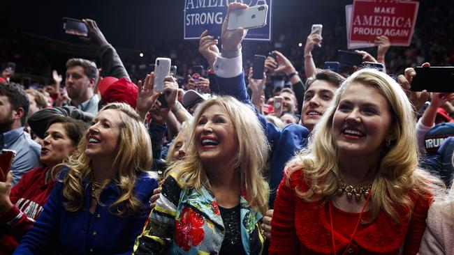 Supporters of President Donald Trump listen to him speak at a campaign rally in Charlotte, North Carolina. Picture: AP