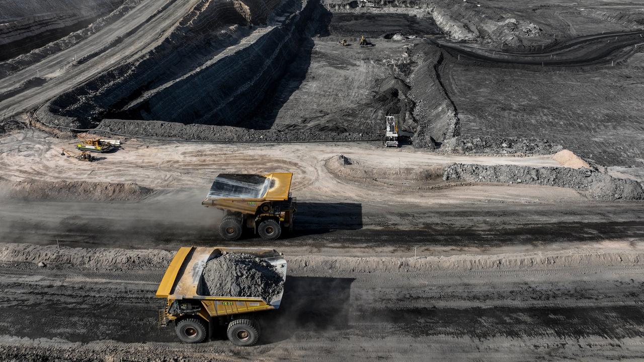 12 April 2022. Coal mining operations from Bravus (formerly known as Adani) at their Carmichael Coal Mine, Qld. Haul trucks as part of interburden removal to expose the next coal seam at the Carmichael mine PIC: Cameron Laird