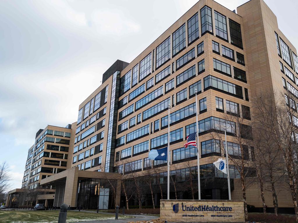 Flags fly at half mast outside UnitedHealthcare. Picture: Stephen Maturen/Getty Images/AFP