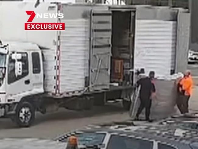 Channel 7 screengrabs of CCTV footage showing the three NSW removalists at the Ariele Apartments, the cause of the current Covid-19 outbreak in Victoria.