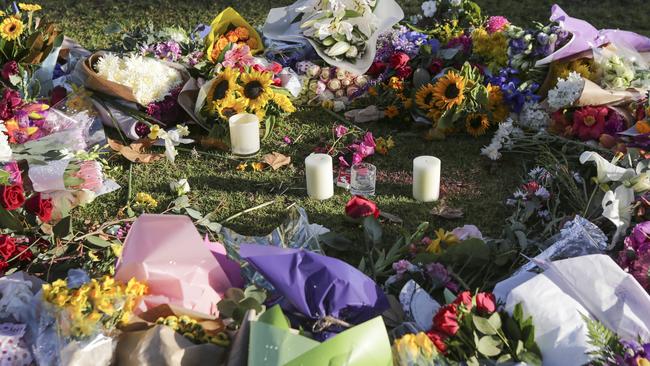 A floral tribute for Eurydice Dixon, who was killed while walking home at night last June. Picture: Wayne Taylor 