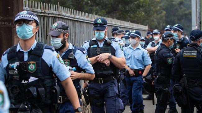 Huge numbers of police and riot squad muster at Victoria Park.