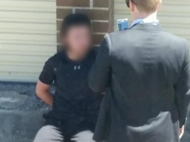 Police speak with one of the teen terror suspects. Picture: Seven News