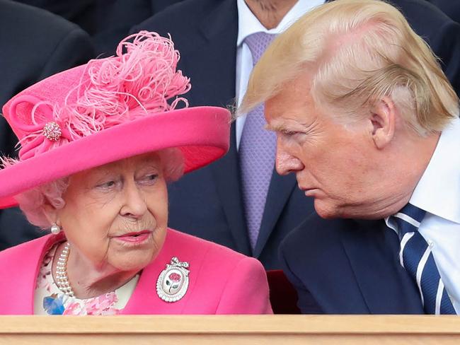 (FILES) In this file photo taken on June 5, 2019 Britain's Queen Elizabeth II (L) reacts as she sits with US President Donald Trump an event to commemorate the 75th anniversary of the D-Day landings, in Portsmouth, southern England. - Queen Elizabeth II, the longest-serving monarch in British history and an icon instantly recognisable to billions of people around the world, has died aged 96, Buckingham Palace said on September 8, 2022. Her eldest son, Charles, 73, succeeds as king immediately, according to centuries of protocol, beginning a new, less certain chapter for the royal family after the queen's record-breaking 70-year reign. (Photo by Chris Jackson / POOL / AFP)