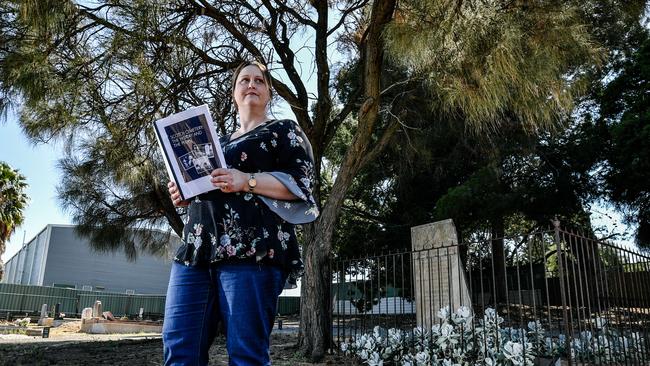 Kelly Dyer in Morphett Vale Cemetery, where she has collected stories of who has been buried there. Picture: AAP/ Morgan Sette