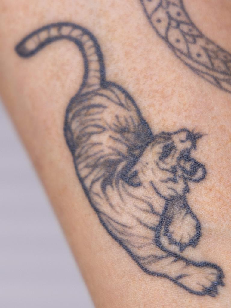 The tattoo of a tiger Lexi Dignam wants removed from her arm. Picture: Kelly Barnes