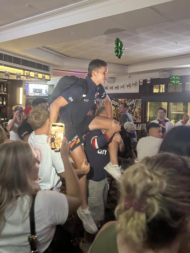 Sydney Roosters debutant and local boy Hugo Savala is chaired by his mates after beating the Panthers.