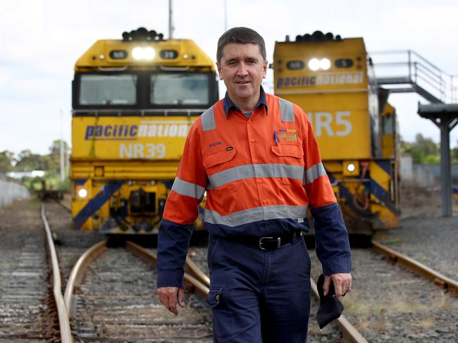 Freight train driver Wayne Blewden is helping keep Australia's economy on track by moving critical freight around the country during the COVID-19 pandemic that is shutting down countries and borders around Australia and the world. Pictured at the Pacific National yards in Chullora. Picture: Toby Zerna