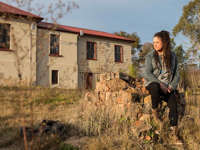 Cobargo artist Sally Wilson lost her studio in the Black Summer Bushfires. Sally is pictured where her studio once stood on the main street of Cobargo. Picture: Ben Marden