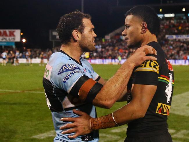 Dale Finucane of the Sharks looks at the ear of Stephen Crichton of the Panthers after the round 19 NRL match between the Penrith Panthers and the Cronulla Shark. Picture: Matt Blyth/Getty Images