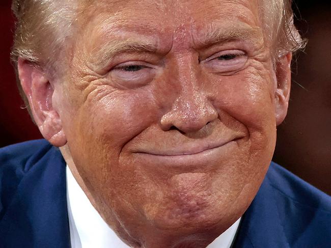 TOPSHOT - Former US President and Republican presidential candidate Donald Trump attends a town hall meeting moderated by Arkansas Governor Sarah Huckabee Sanders at the Dort Financial Center in Flint, Michigan, on September 17, 2024. (Photo by JEFF KOWALSKY / AFP)