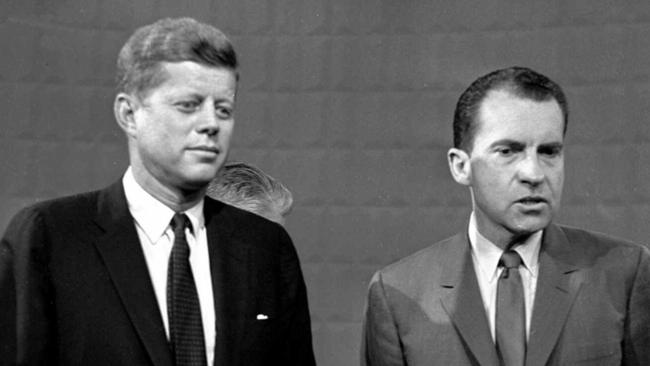 John Kennedy and Richard Nixon pose after their debate at a Chicago television studio in 1960.