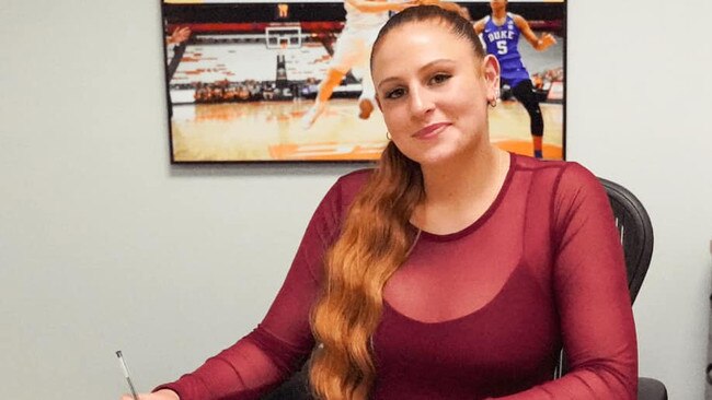 Tiana Mangakahia signing her training camp contract with WNBA team the Phoenix Mercury.