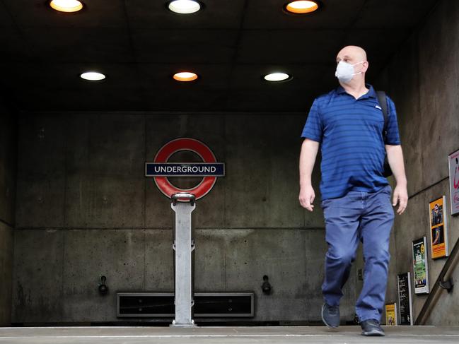 A man wearing face mask leaves Westminster tube station in London. Picture: AP