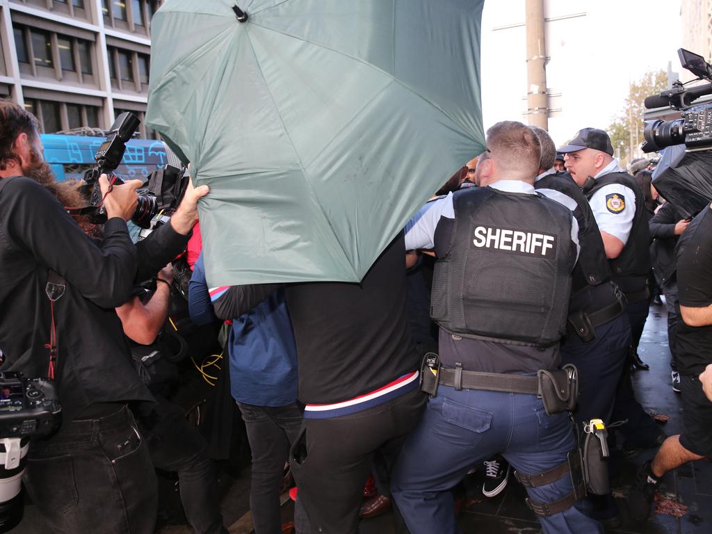 Jarryd Hayne supporters clash with the media out the front of Newcastle Court.