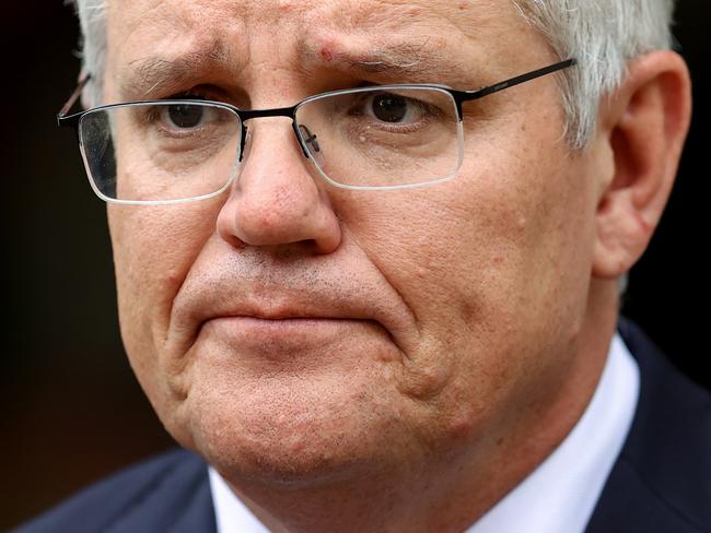 SYDNEY, AUSTRALIA - OCTOBER 15: Australian Prime Minister Scott Morrison speaks during a media conference on October 15, 2021 in Sydney, Australia. Prime Minister Scott Morrison has responded to the NSW government's announcement they would lift passenger caps and remove quarantine requirements for vaccinated international travellers from 1 November 2021. The Prime Minister clarified the rules would only apply to Australian citizens, residents and their immediate families. In the same press conference, Prime Minister Scott Morrison also confirmed he would attend 2021 United Nations Climate Change Conference in Glasgow. (Photo by Brendon Thorne/Getty Images)