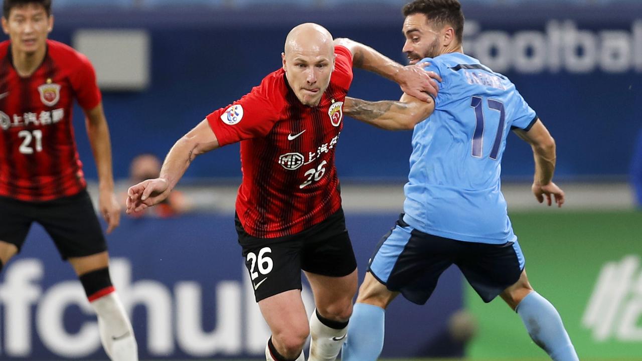 Aaron Mooy of Shanghai SIPG and Anthony Caceres of Sydney FC compete for the ball during the AFC Champions League Group H match in December.