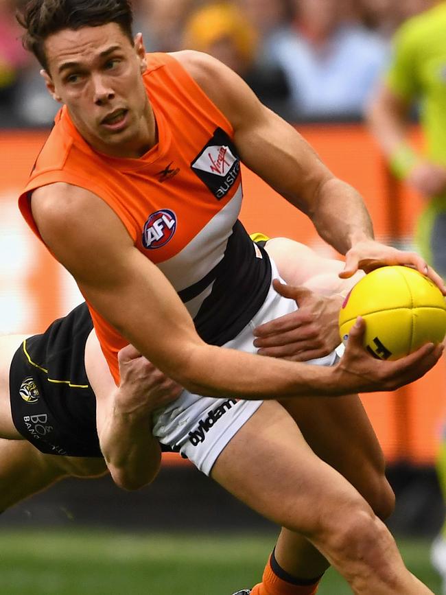 Josh Kelly of the Giants is tackled by Jacob Townsend of the Tigers. Picture: Quinn Rooney/Getty Images