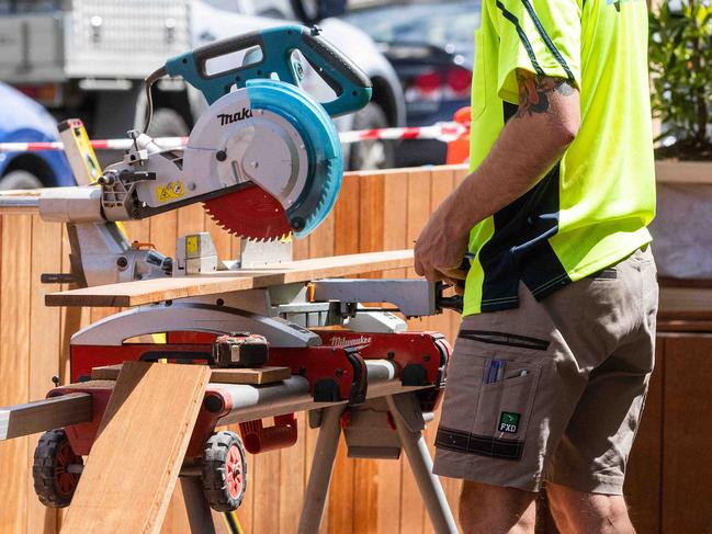 MELBOURNE, AUSTRALIA - NewsWire Photos - OCTOBER 21, 2021:  Melbourne will come out of lockdown tonight at 11:59pm, Marion Wine Bar in Gertrude Street Fitzroy is preparing for re opening tomorrow  Carpenters seen working on a new outdoor area. Picture: NCA NewsWire/Sarah Matray