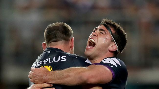 Melbourne's Dale Finucane celebrates a try with Cameron Smith during the 2017 NRL Grand Final between the Melbourne Storm and the North Queensland Cowboys at ANZ Stadium. Picture. Phil Hillyard