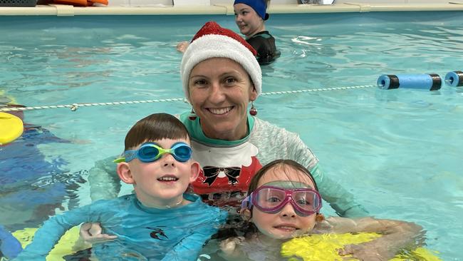 Phillip Island Swim School teacher Lawri Piera with students Parker and Winter.