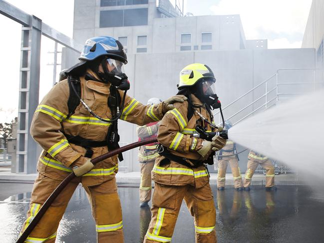 EMBAGOED USE. The new Victorian Emergency Management Training facility can simulate fires and other emergency situations allowing fire fighters and other emergency service personnel to train at the new facility. The centre also includes Melbourne-specific scenario training so crews can practice rescues from areas such as the Domain Tunnel. MFB Fire fighters train in the Burnley Tunnel truck fire scenario.    Picture: David Caird.