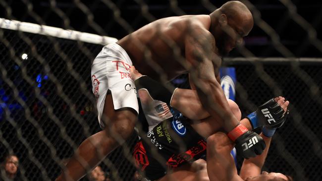 LOS ANGELES, CA — FEBRUARY 28: (Top) Derrick Lewis punches Ruan Potts in their heavyweight bout during the UFC 184 event at Staples Center on February 28, 2015 in Los Angeles, California. (Photo by Harry How/Getty Images)