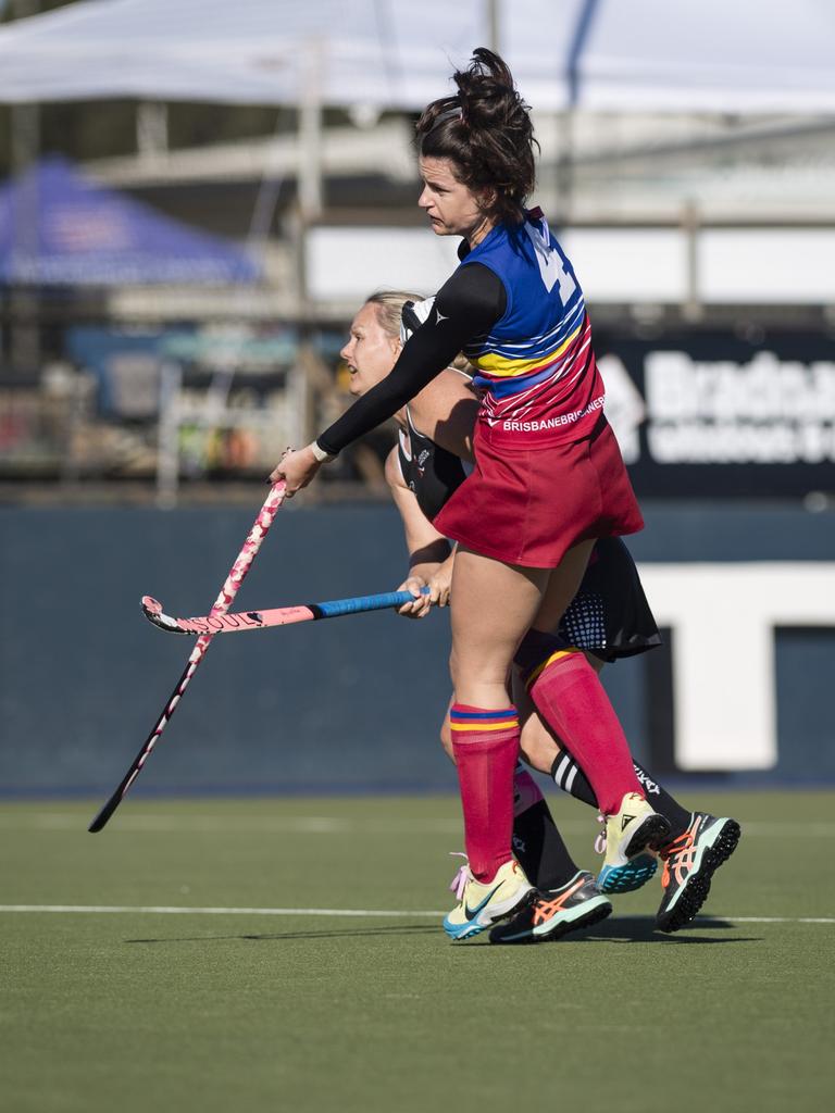 Rachael Stokes (front) of Brisbane 2 and Mackay 1 captain Ellen Crawford.