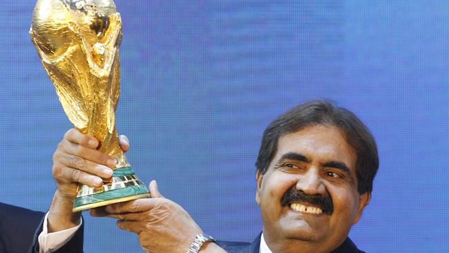 Qatar’s emir Sheikh Hamad bin Khalifa Al-Thani, Emir of Qatar, with the World Cup trophy. Picture: AP