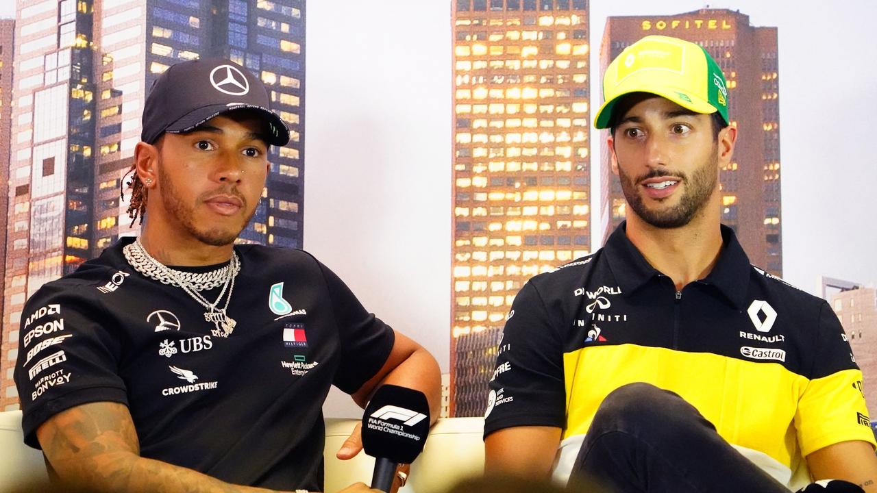 Lewis Hamilton and Daniel Ricciardo look concerned.