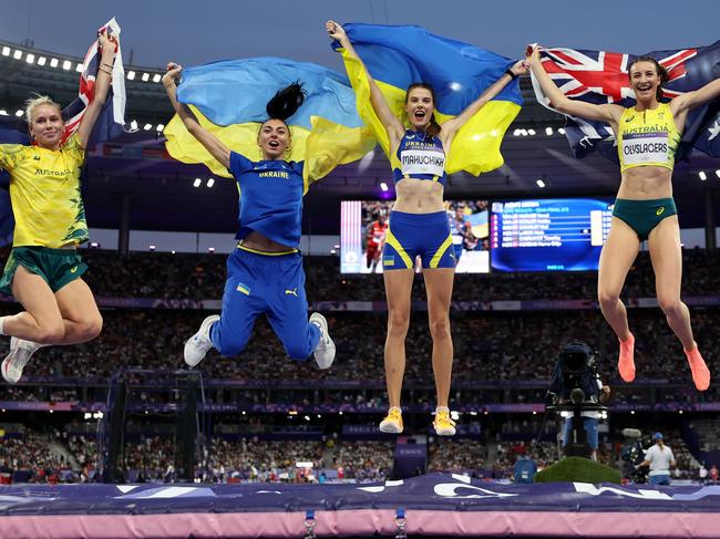 PARIS, FRANCE - AUGUST 04: (L-R) Bronze medalist Eleanor Patterson of Team Australia , Iryna Gerashchenko of Team Ukraine, Gold medalist Yaroslava Mahuchikh and Silver medalist Nicola Olyslagers of Tram Australia celebrate during the Women's High Jump Final on day nine of the Olympic Games Paris 2024 at Stade de France on August 04, 2024 in Paris, France. (Photo by Cameron Spencer/Getty Images)