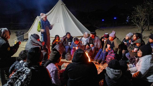 A volunteer instructs immigrants on speaking with US Border Patrol agents at a humanitarian camp next to the Mexico border. Picture: AFP.